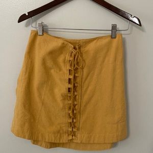 Free people miniskirt color is mustard: size S
